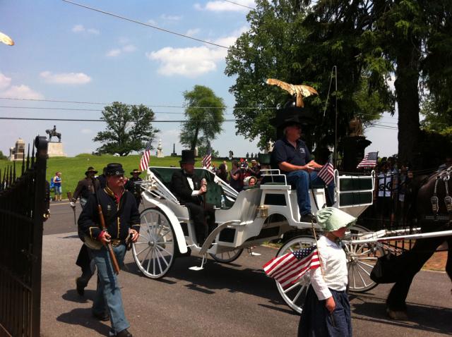 Lincoln: An actor playing Abraham Lincoln enters the military cemetery at Gettysburg. His counterpart, playing Jefferson Davis, announced at the parade's end that he was not staying for the ceremony but was off to get a beer on the hot day.